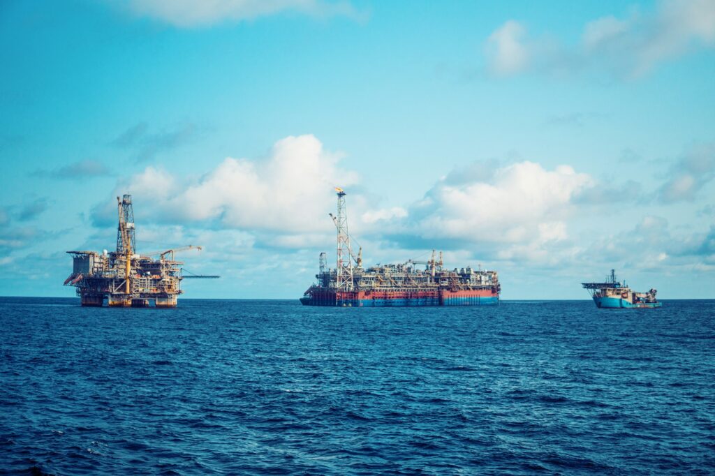 FPSO tanker vessel near Oil Rig platform. Offshore oil and gas industry
